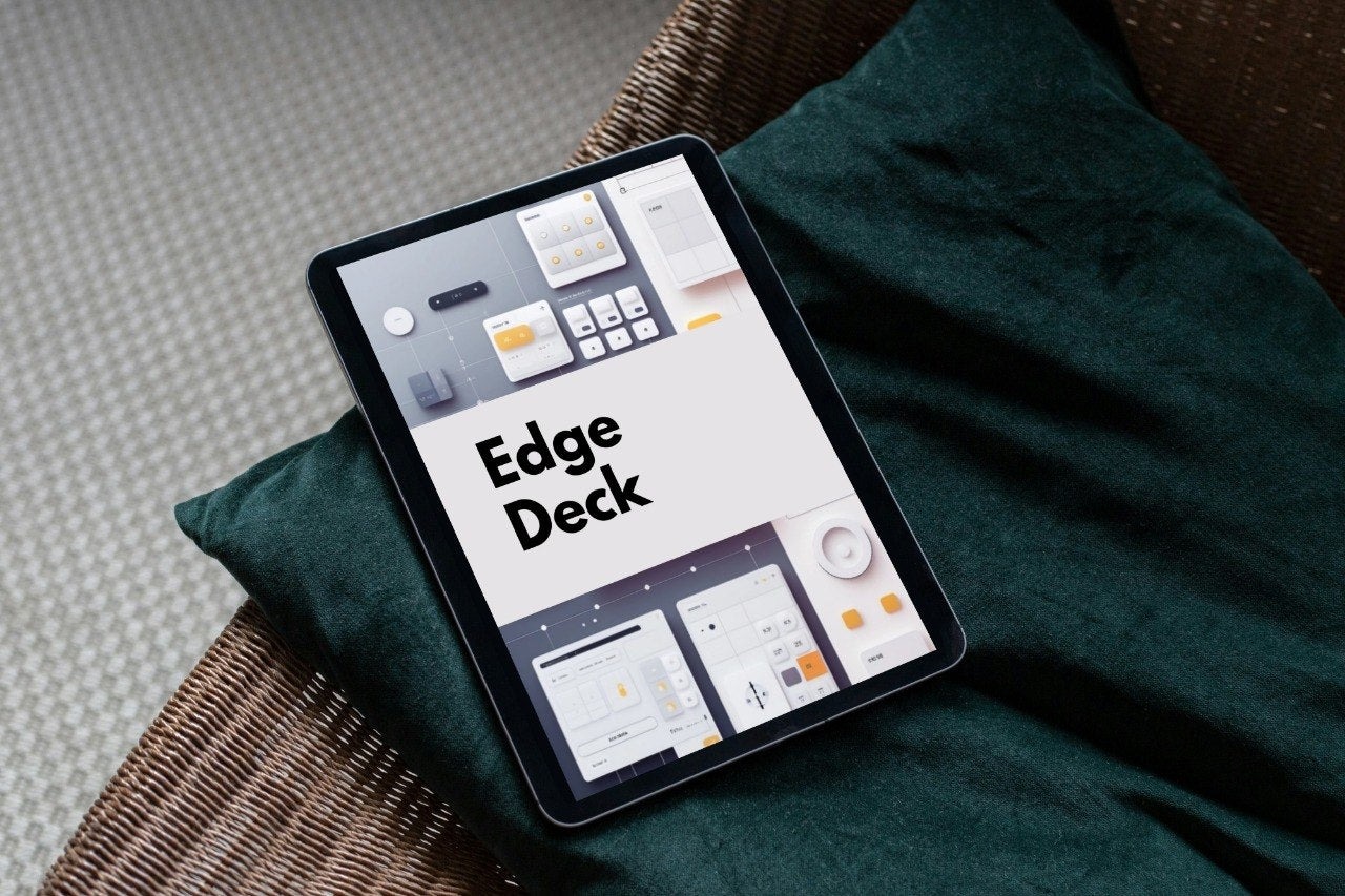 A tablet device displaying the Edge Deck interface, resting on a dark green cushion over a woven chair seat.